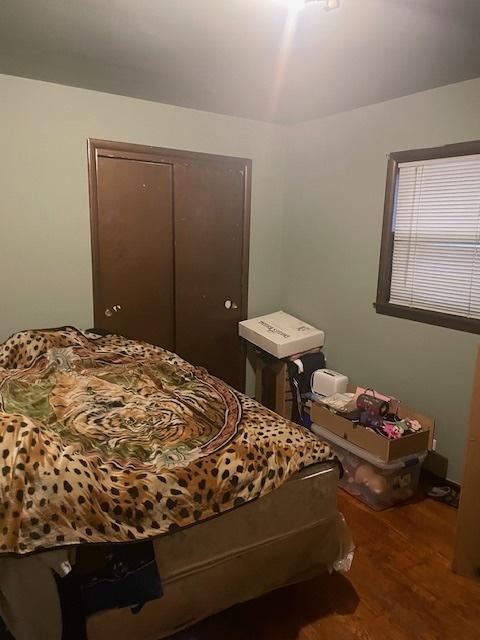 bedroom featuring a closet and wood finished floors