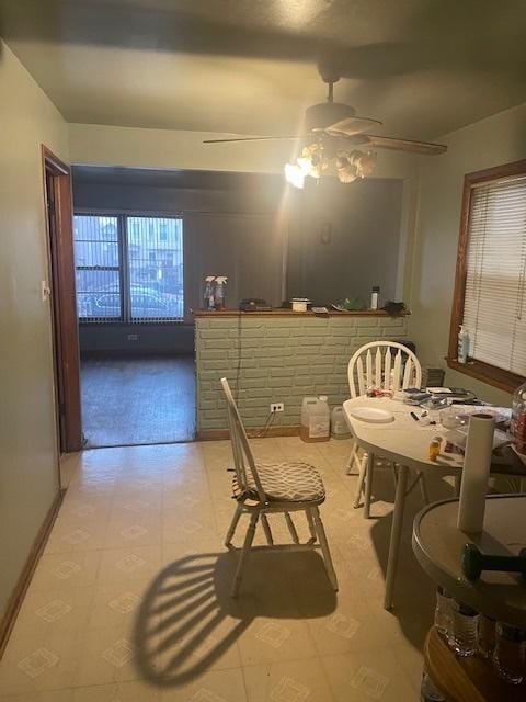 dining room featuring a ceiling fan and tile patterned floors