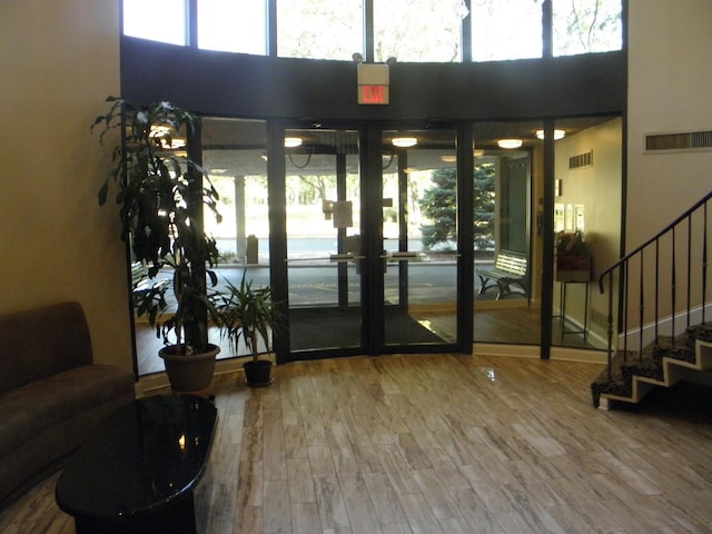 lobby featuring stairs and visible vents