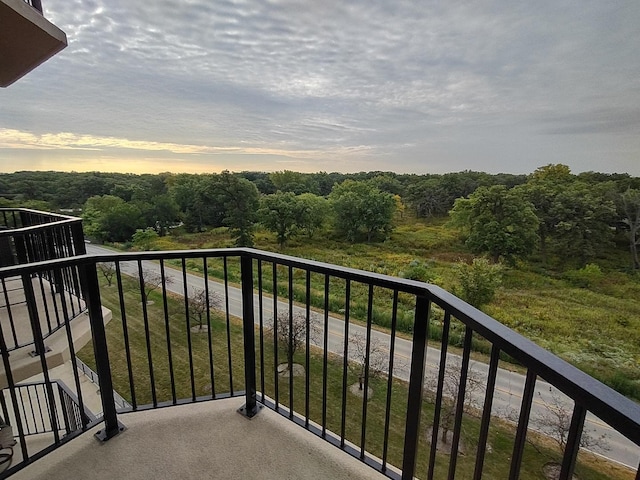 view of balcony at dusk