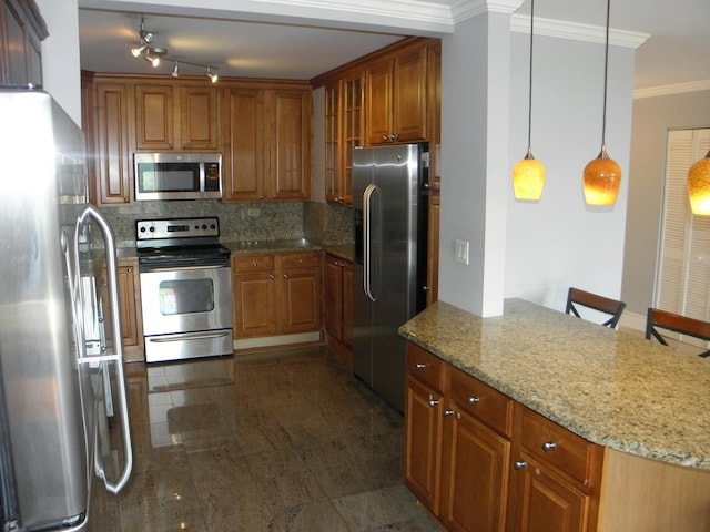 kitchen with light stone counters, ornamental molding, appliances with stainless steel finishes, tasteful backsplash, and brown cabinetry