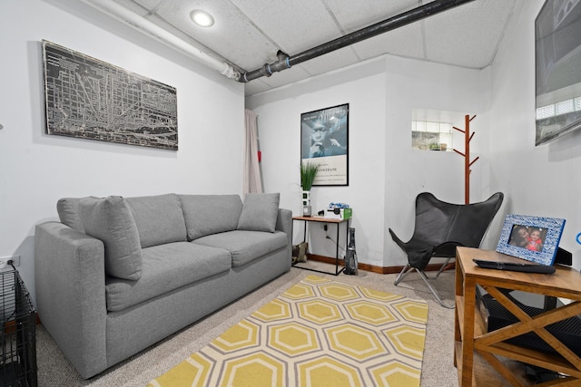 living area featuring baseboards