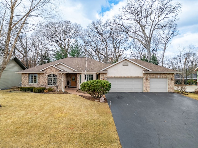 ranch-style house with brick siding, a front lawn, aphalt driveway, roof with shingles, and a garage