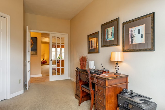 carpeted office featuring french doors and baseboards