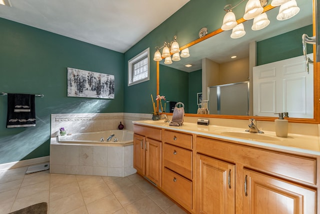 bathroom featuring tile patterned flooring, a shower stall, double vanity, a bath, and a sink