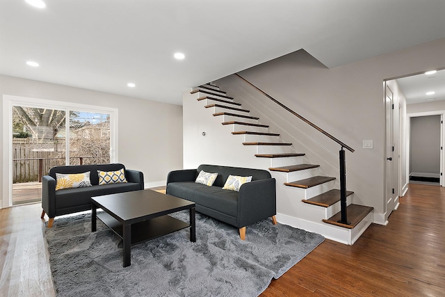 living room with stairway, recessed lighting, baseboards, and wood finished floors