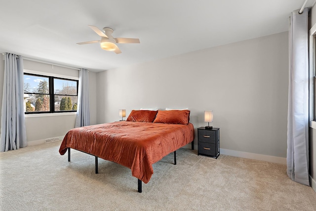 bedroom with carpet, visible vents, and baseboards