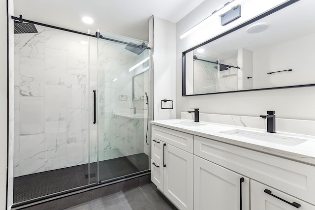 full bath featuring a sink and a marble finish shower