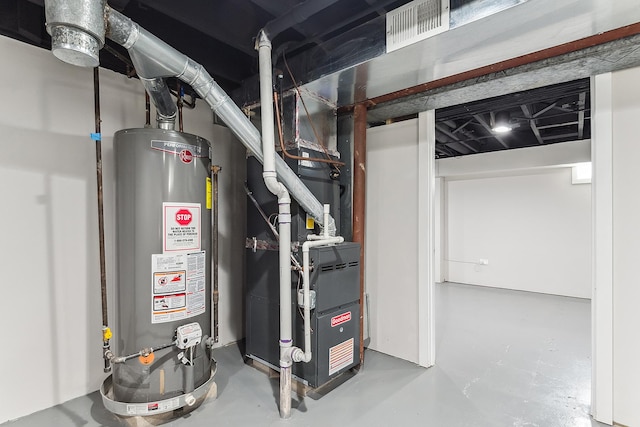 utility room featuring visible vents and gas water heater