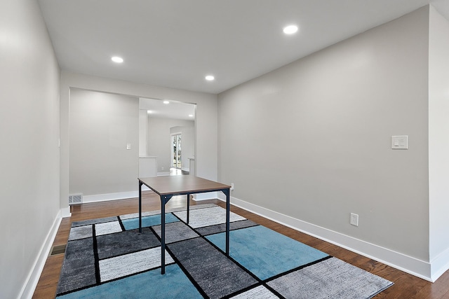 office featuring dark wood finished floors, visible vents, recessed lighting, and baseboards