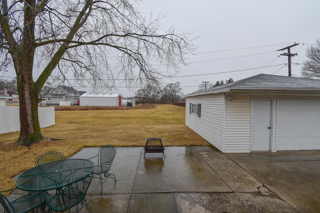 view of patio with fence and an outdoor structure