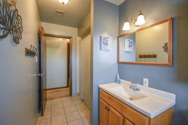 full bath with tile patterned flooring, visible vents, and vanity