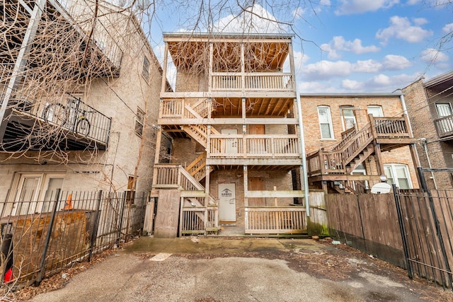 exterior space featuring stairway and fence