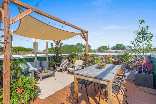 wooden terrace featuring an outdoor hangout area and outdoor dining area