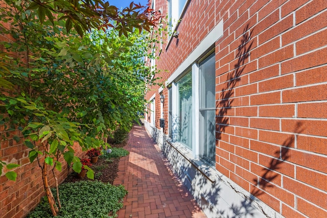 view of home's exterior with brick siding