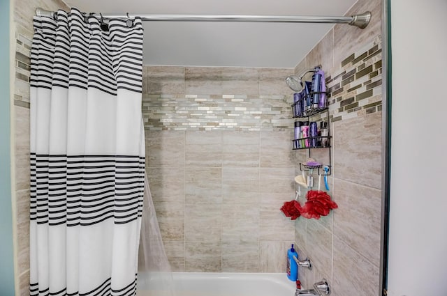 bathroom featuring shower / bath combo with shower curtain