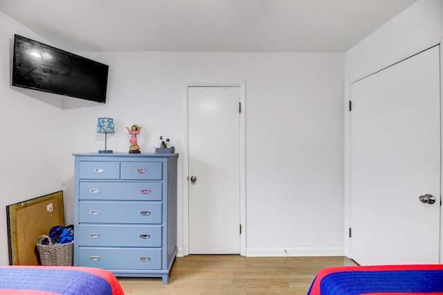 bedroom with light wood-style floors