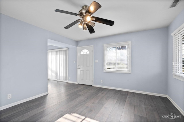 entryway with a ceiling fan, dark wood-style flooring, visible vents, and baseboards