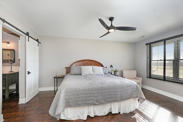 bedroom with a ceiling fan, baseboards, visible vents, dark wood-style flooring, and a barn door