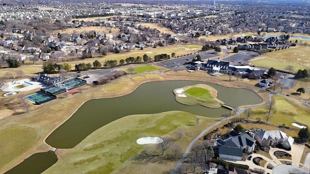 aerial view featuring a residential view, a water view, and view of golf course