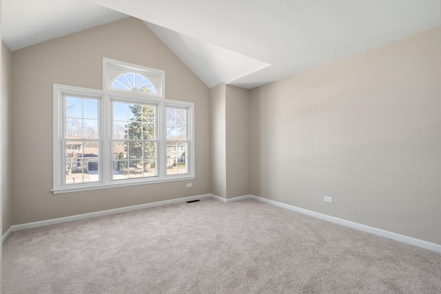 bonus room featuring baseboards, vaulted ceiling, and carpet flooring