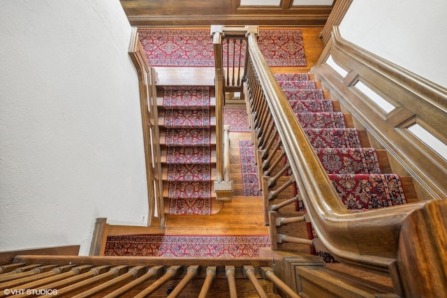 staircase with a textured wall