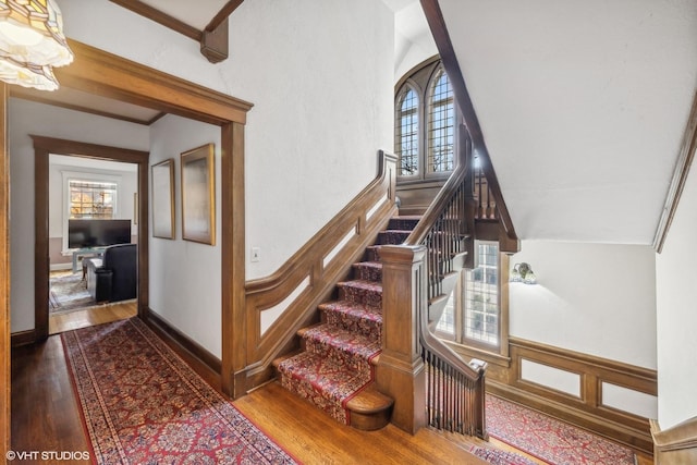 stairway featuring wood finished floors