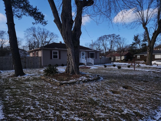 view of front of house featuring fence