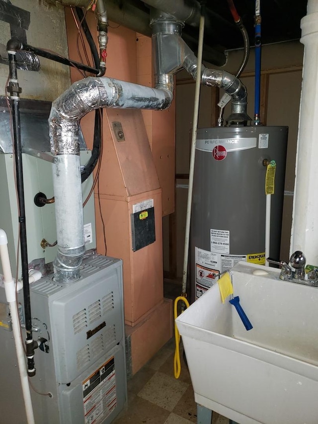 utilities featuring water heater and a sink