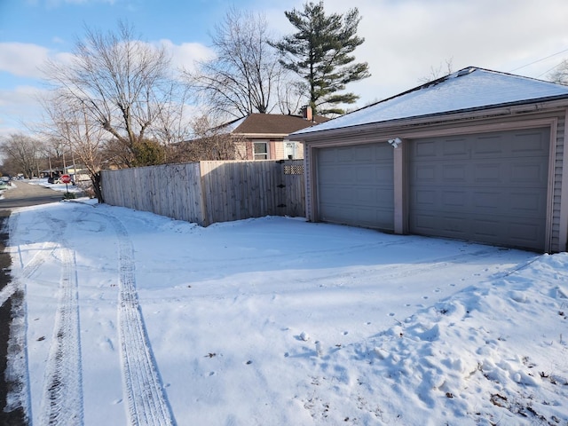 exterior space with a garage and fence