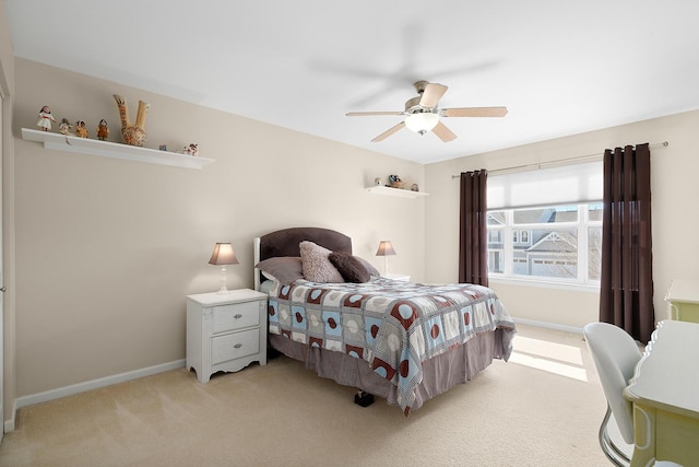 bedroom with carpet flooring, a ceiling fan, and baseboards