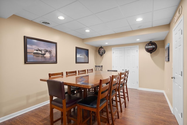 dining room with recessed lighting, baseboards, and dark wood-style flooring