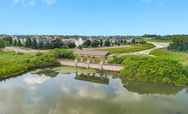 bird's eye view with a residential view and a water view