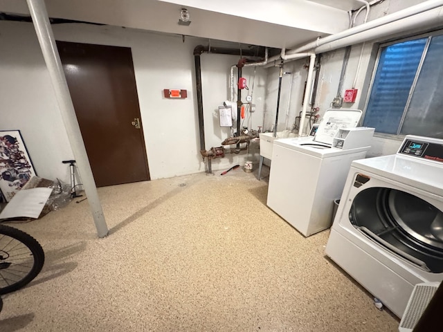 clothes washing area featuring laundry area and independent washer and dryer