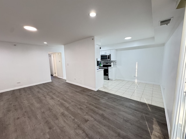 interior space featuring recessed lighting, visible vents, and baseboards