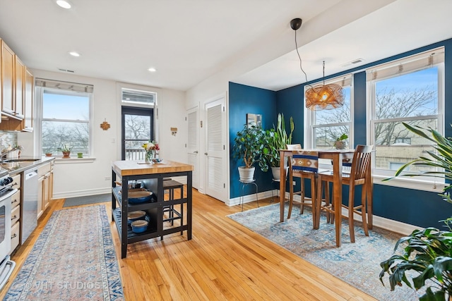 dining area with recessed lighting, baseboards, and light wood-style floors