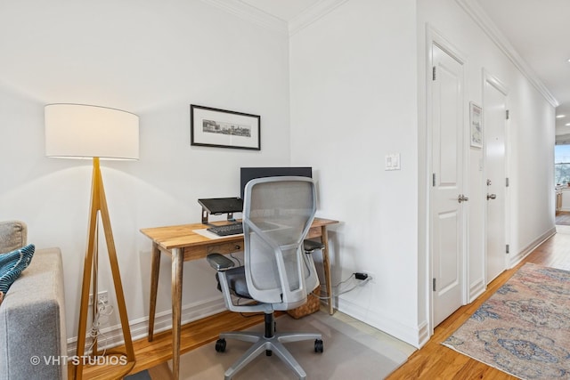 office featuring baseboards, wood finished floors, and crown molding