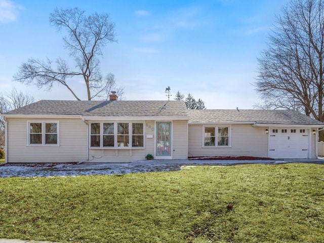 view of front of home with a garage, a front lawn, a chimney, and a shingled roof