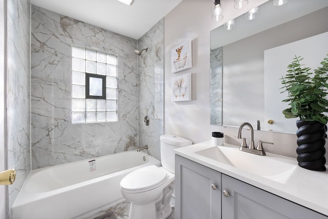 bathroom featuring marble finish floor, shower / washtub combination, vanity, and toilet