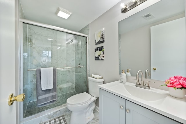 bathroom with toilet, vanity, visible vents, marble finish floor, and a stall shower