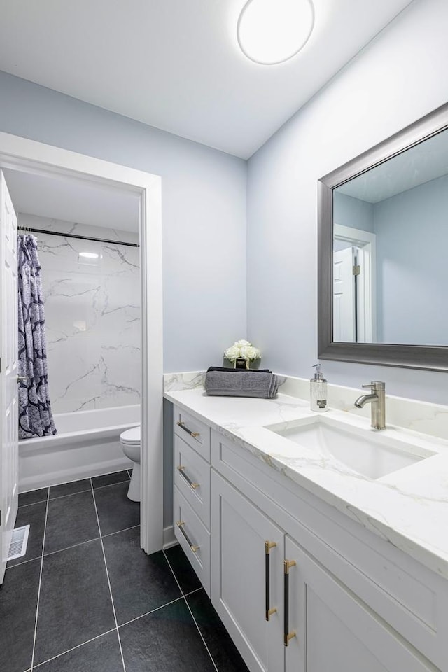 bathroom featuring tile patterned flooring, shower / bathtub combination with curtain, vanity, and toilet