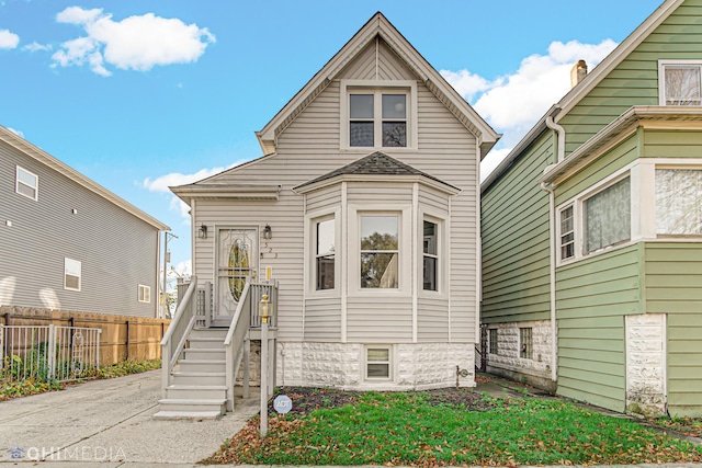 view of front of house with fence