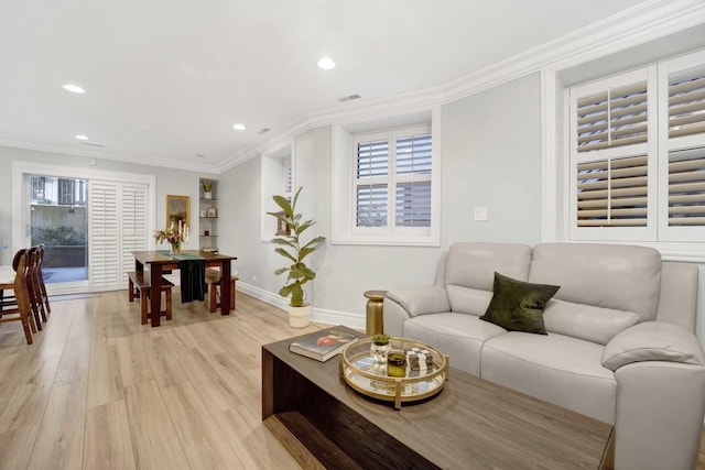 living area featuring light wood-type flooring, visible vents, ornamental molding, recessed lighting, and baseboards