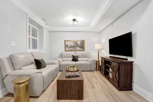 living area with light wood finished floors, baseboards, and ornamental molding