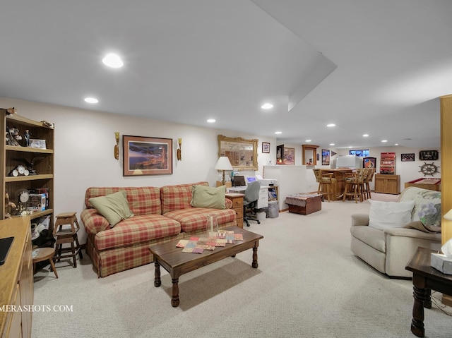 carpeted living area featuring recessed lighting and a dry bar