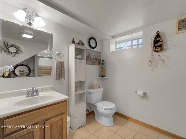 full bathroom featuring baseboards, toilet, a shower with shower door, tile patterned floors, and vanity