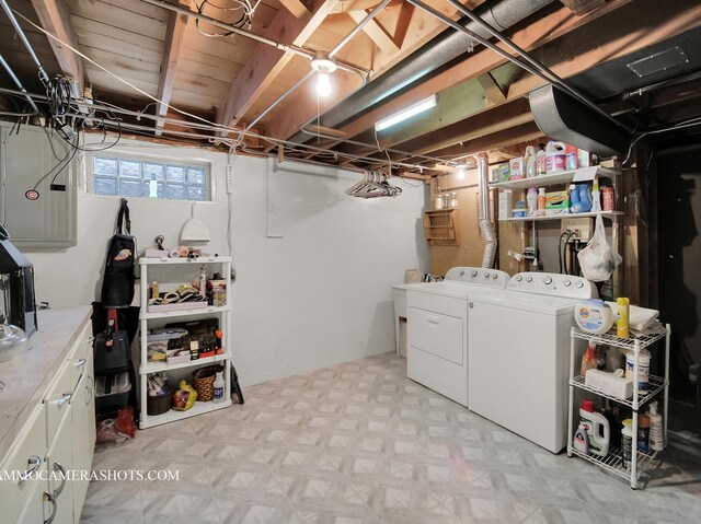 basement with light floors and independent washer and dryer