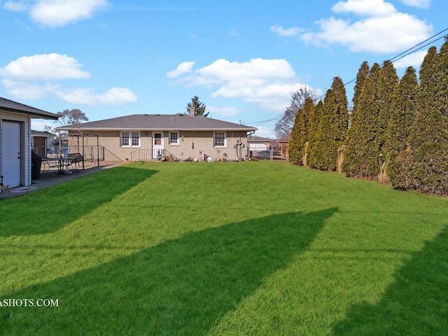 view of yard with a patio area and fence