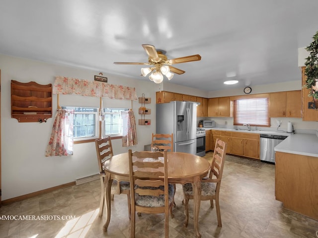 dining space featuring a ceiling fan, visible vents, and baseboards