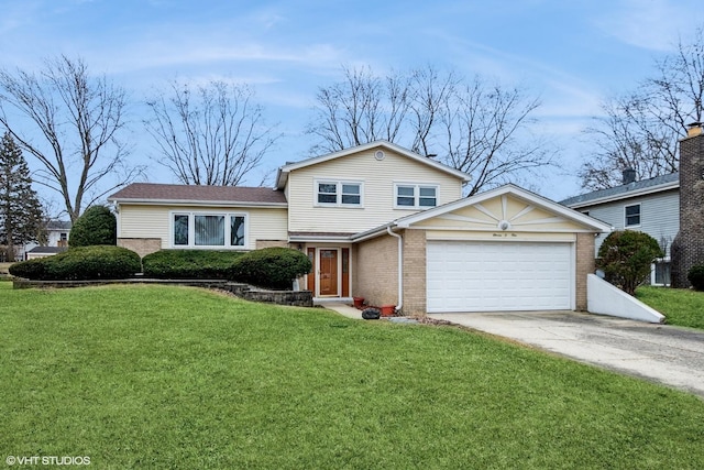 tri-level home with a garage, concrete driveway, brick siding, and a front yard